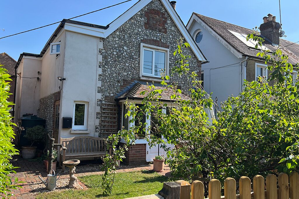 Flint-front cottage with its front garden