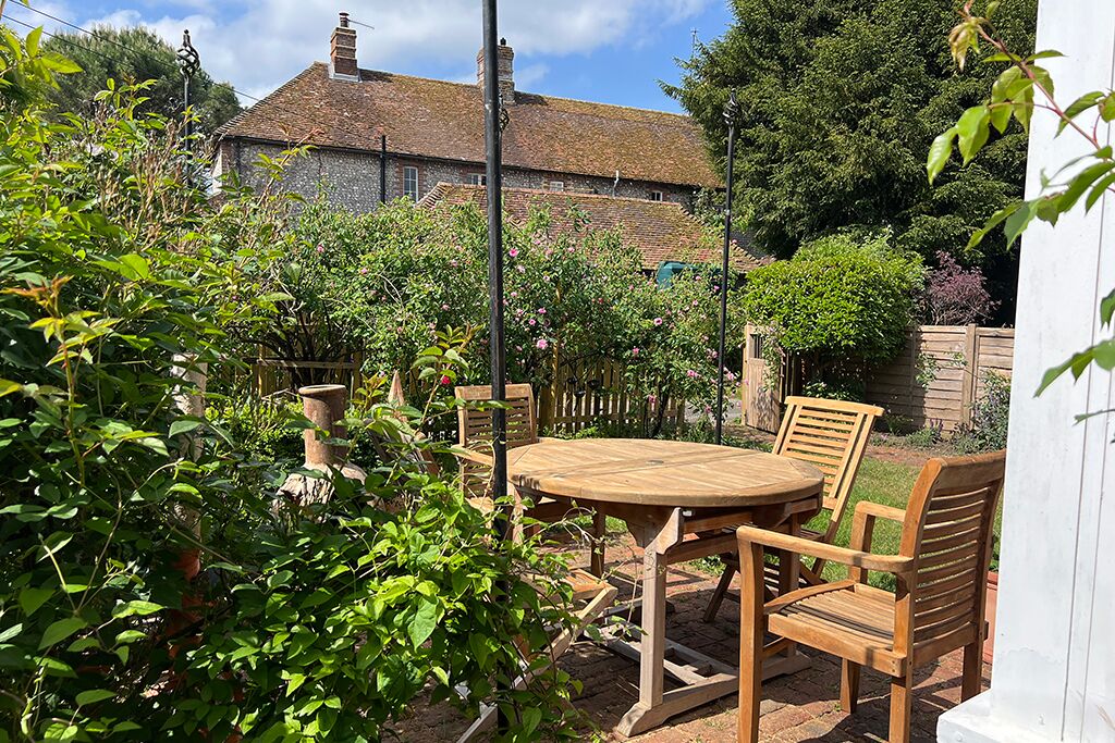 Wooden table and chairs on the garden patio